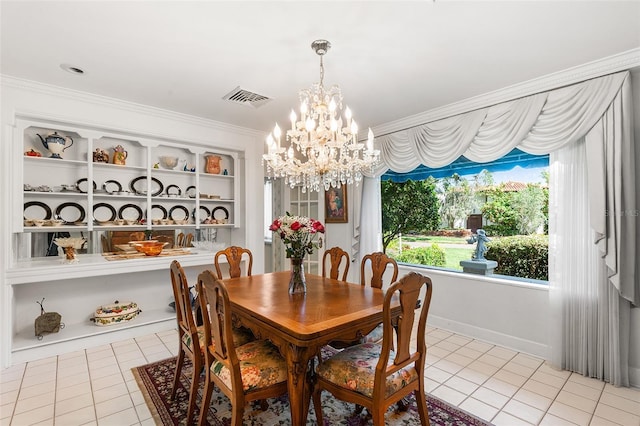 2110 Reaney Rd, Lakeland, FL 33803 - dining space featuring light tile patterned flooring, a chandelier, and crown molding