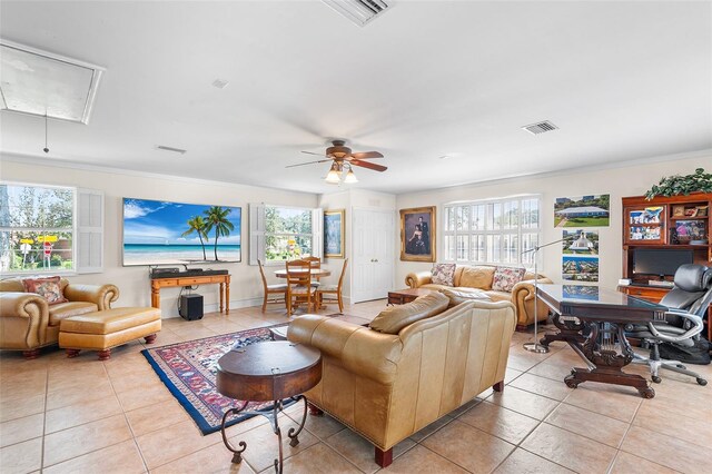 2110 Reaney Rd, Lakeland, FL 33803 - living area featuring attic access, light tile patterned floors, a ceiling fan, and ornamental molding