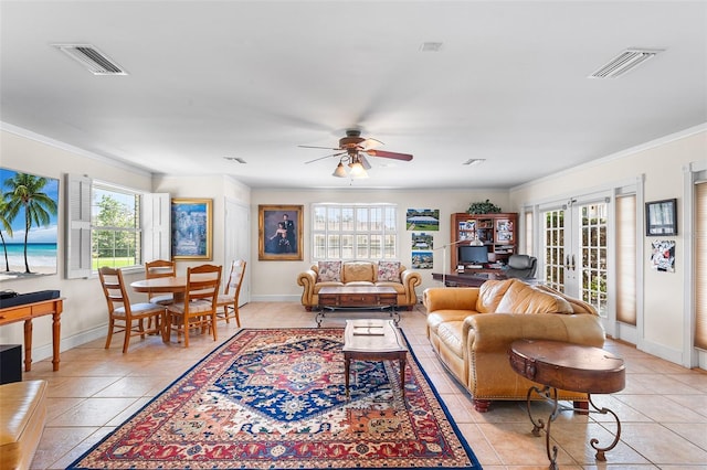 2110 Reaney Rd, Lakeland, FL 33803 - living room with light tile patterned floors, a ceiling fan, baseboards, ornamental molding, and french doors
