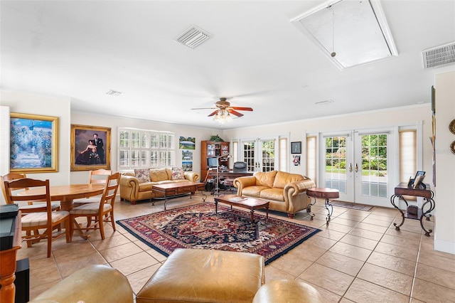 2110 Reaney Rd, Lakeland, FL 33803 - living area with attic access, french doors, light tile patterned floors, crown molding, and a ceiling fan