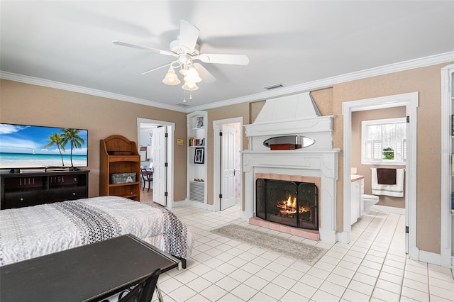 2110 Reaney Rd, Lakeland, FL 33803 - bedroom featuring ornamental molding, light tile patterned floors, a large fireplace, ensuite bathroom, and baseboards