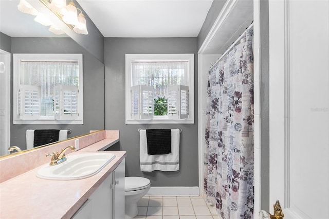 2110 Reaney Rd, Lakeland, FL 33803 - bathroom with vanity, toilet, tile patterned floors, and a shower with curtain