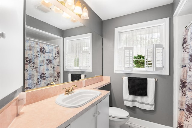 2110 Reaney Rd, Lakeland, FL 33803 - bathroom featuring vanity, toilet, and a shower with curtain