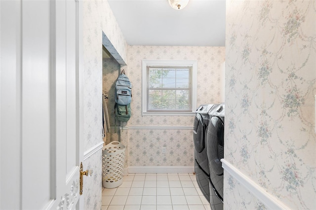 2110 Reaney Rd, Lakeland, FL 33803 - washroom featuring washing machine and clothes dryer, light tile patterned floors, and wallpapered walls