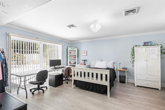 2110 Reaney Rd, Lakeland, FL 33803 - bedroom featuring a desk, ornamental molding, wood finished floors, and a chandelier