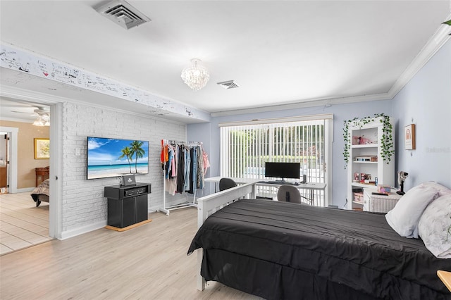 2110 Reaney Rd, Lakeland, FL 33803 - bedroom featuring light wood finished floors, ornamental molding, and a chandelier