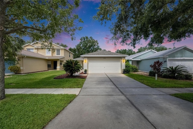 11728 Crest Creek Dr, Riverview, FL 33569 - view of front of house with a front yard, concrete driveway, stucco siding, and a garage