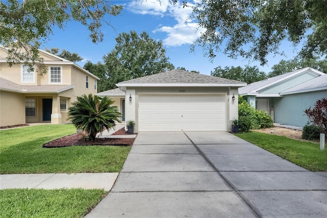 11728 Crest Creek Dr, Riverview, FL 33569 - view of front of house with stucco siding, concrete driveway, a front lawn, and an attached garage