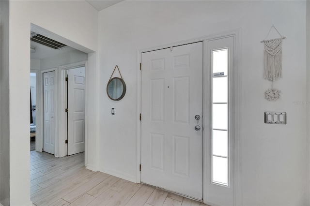 11728 Crest Creek Dr, Riverview, FL 33569 - foyer with baseboards and light wood-type flooring