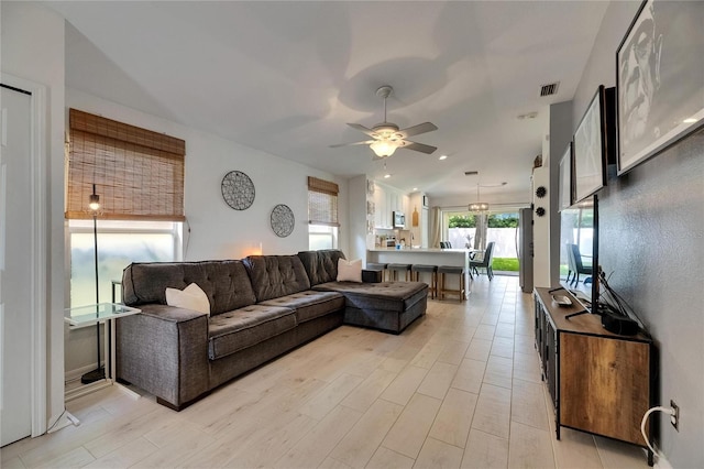 11728 Crest Creek Dr, Riverview, FL 33569 - living area featuring a ceiling fan and light wood finished floors