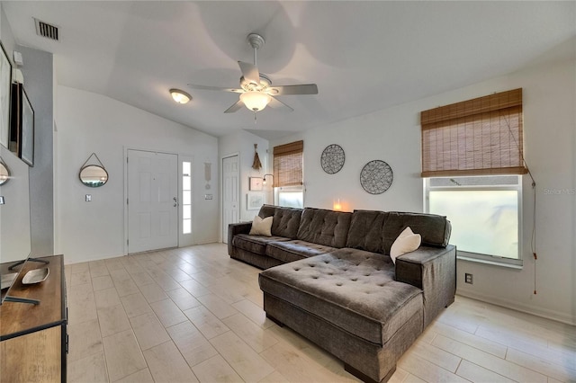 11728 Crest Creek Dr, Riverview, FL 33569 - living room featuring a ceiling fan, vaulted ceiling, and light wood finished floors