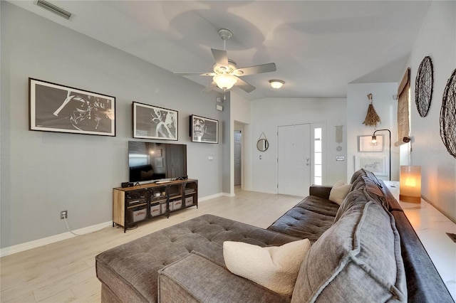11728 Crest Creek Dr, Riverview, FL 33569 - living room with a ceiling fan, lofted ceiling, baseboards, and light wood-type flooring
