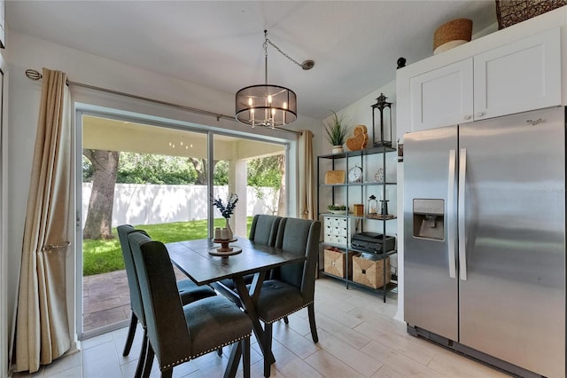 11728 Crest Creek Dr, Riverview, FL 33569 - dining area featuring a chandelier and light wood-type flooring
