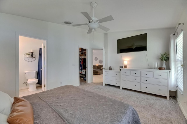 11728 Crest Creek Dr, Riverview, FL 33569 - bedroom featuring a spacious closet, ensuite bath, carpet flooring, and ceiling fan