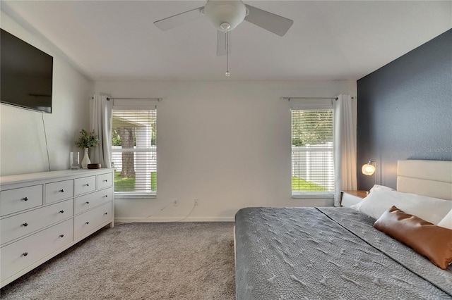 11728 Crest Creek Dr, Riverview, FL 33569 - bedroom with light colored carpet, multiple windows, baseboards, and ceiling fan