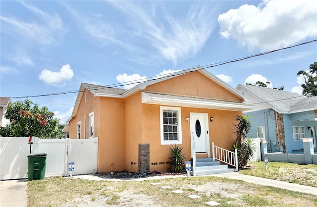 2137 W Saint Louis St, Tampa, FL 33607 - view of front of home featuring stucco siding and a gate