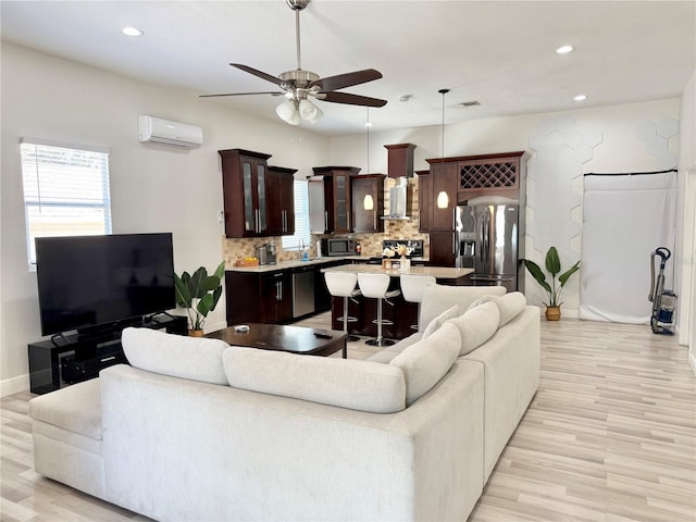 2137 W Saint Louis St, Tampa, FL 33607 - living area featuring a wall unit AC, light wood finished floors, a ceiling fan, recessed lighting, and baseboards