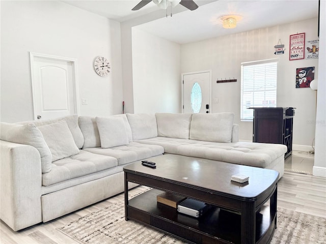 2137 W Saint Louis St, Tampa, FL 33607 - living room with a ceiling fan, light wood finished floors, and baseboards