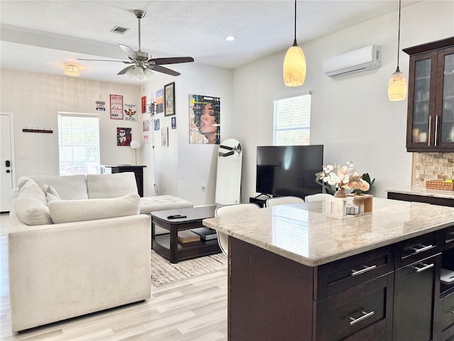 2137 W Saint Louis St, Tampa, FL 33607 - living area featuring a wall mounted AC, plenty of natural light, light wood-style floors, a ceiling fan, and recessed lighting