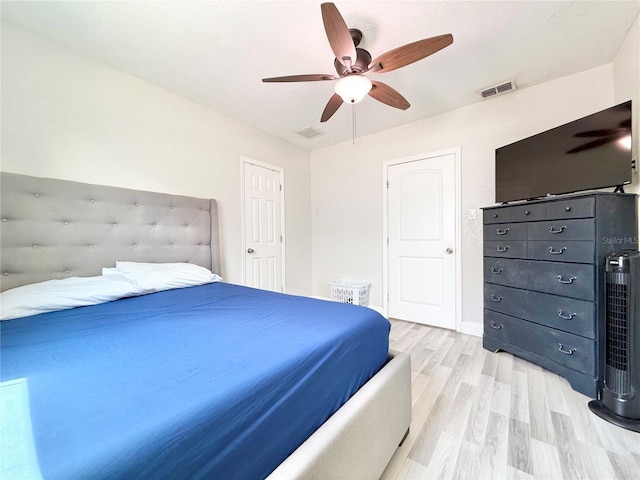 2137 W Saint Louis St, Tampa, FL 33607 - bedroom with light wood-style flooring and ceiling fan