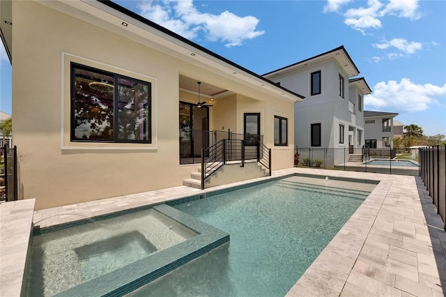 6532 Simone Shores Cir, Apollo Beach, FL 33572 - rear view of house featuring stucco siding, a patio, a ceiling fan, and a pool with connected hot tub
