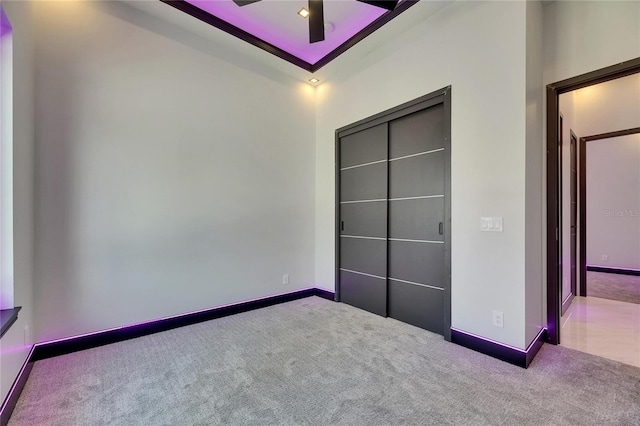 6532 Simone Shores Cir, Apollo Beach, FL 33572 - unfurnished bedroom with carpet floors, baseboards, and ceiling fan