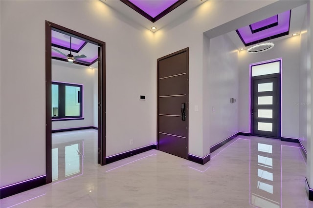 6532 Simone Shores Cir, Apollo Beach, FL 33572 - hall with baseboards, marble finish floors, and a tray ceiling
