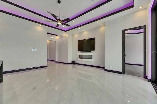 6532 Simone Shores Cir, Apollo Beach, FL 33572 - unfurnished living room featuring a tray ceiling, ceiling fan, recessed lighting, baseboards, and marble tiled flooring