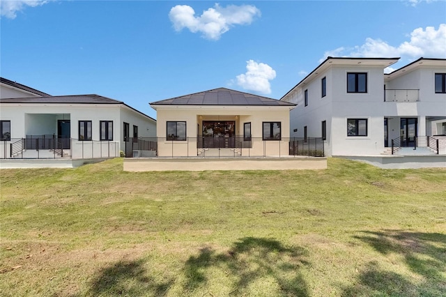 6532 Simone Shores Cir, Apollo Beach, FL 33572 - rear view of property with stucco siding, a lawn, and a patio