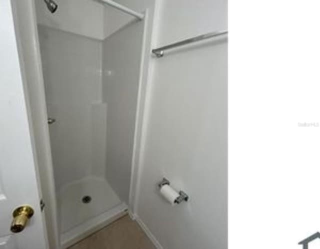 16599 Davis Rd Unit 16599, Fort Myers, FL 33908 - bathroom with a shower and baseboards