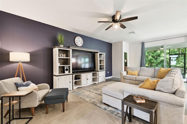 32825 Sand Creek Dr, Wesley Chapel, FL 33543 - living area featuring ceiling fan, light tile patterned floors, and baseboards