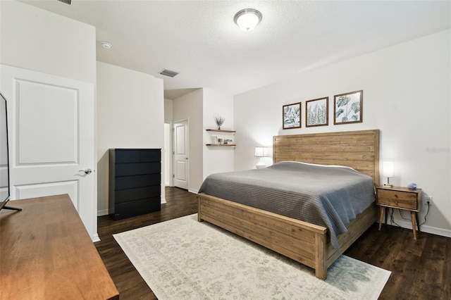 32825 Sand Creek Dr, Wesley Chapel, FL 33543 - bedroom featuring dark wood-style floors and baseboards