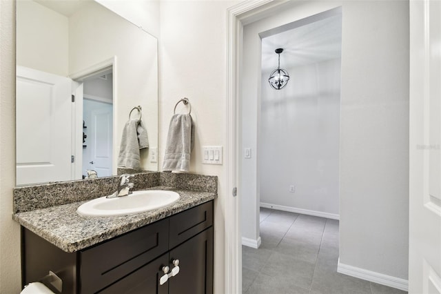 32825 Sand Creek Dr, Wesley Chapel, FL 33543 - bathroom with vanity, tile patterned floors, and baseboards