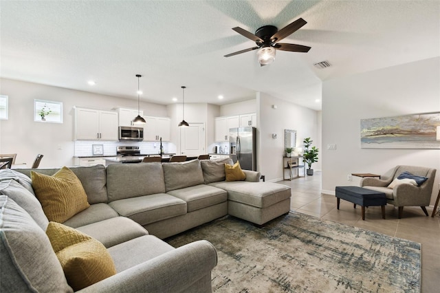 32825 Sand Creek Dr, Wesley Chapel, FL 33543 - living room featuring a ceiling fan, light tile patterned floors, and recessed lighting