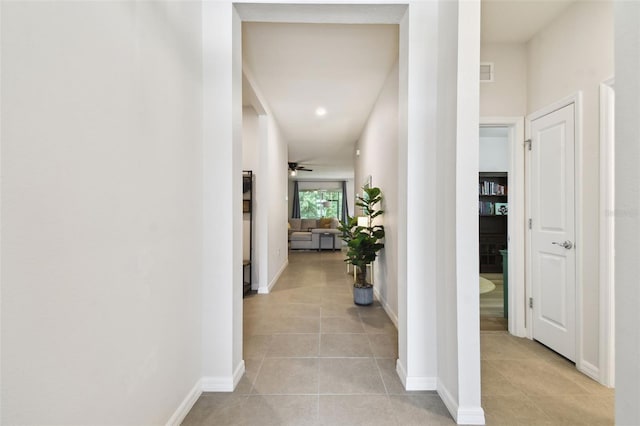 32825 Sand Creek Dr, Wesley Chapel, FL 33543 - corridor featuring light tile patterned floors and baseboards