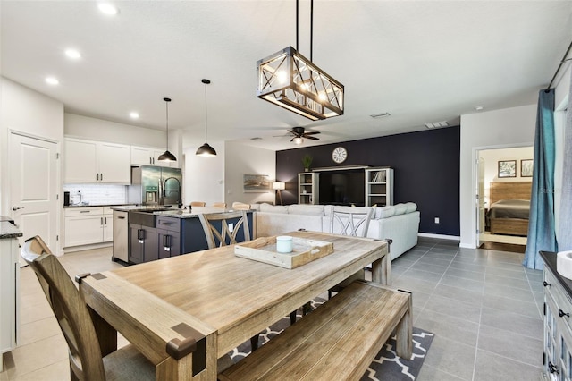 32825 Sand Creek Dr, Wesley Chapel, FL 33543 - dining room featuring a ceiling fan, light tile patterned floors, and recessed lighting