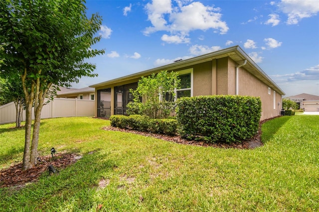 32825 Sand Creek Dr, Wesley Chapel, FL 33543 - view of front of house with stucco siding and a sunroom