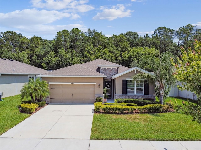 32825 Sand Creek Dr, Wesley Chapel, FL 33543 - view of front of home featuring stone siding, stucco siding, a garage, a front lawn, and concrete driveway