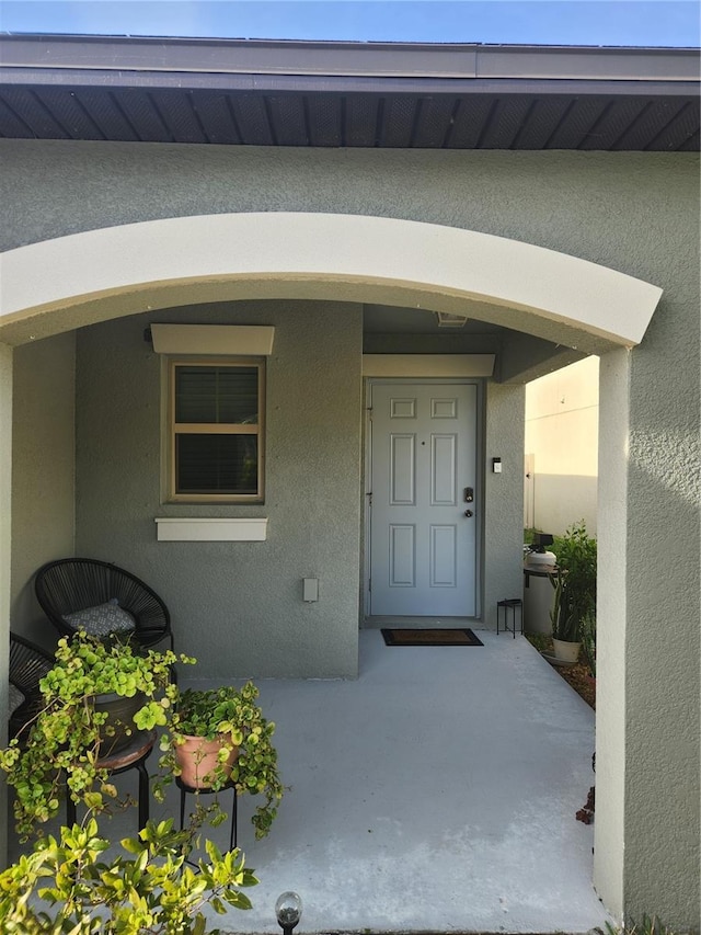 16725 Delia St, Wimauma, FL 33598 - doorway to property featuring stucco siding