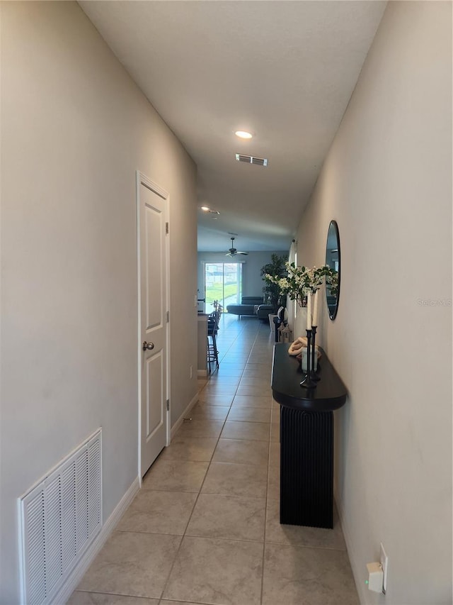 16725 Delia St, Wimauma, FL 33598 - hallway featuring light tile patterned floors and recessed lighting