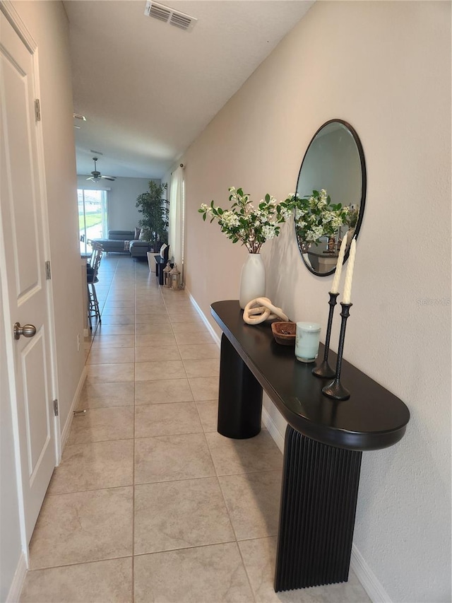 16725 Delia St, Wimauma, FL 33598 - hall featuring light tile patterned floors and baseboards