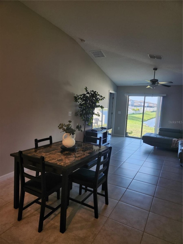 16725 Delia St, Wimauma, FL 33598 - tiled dining space featuring vaulted ceiling and a ceiling fan
