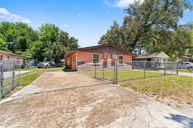 10009 N 10th St, Tampa, FL 33612 - view of front of home with driveway and a gate