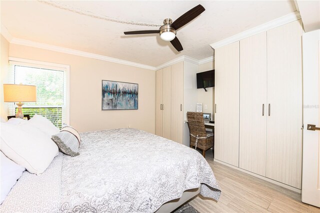2335 Beneva Ter Unit 2254, Sarasota, FL 34232 - bedroom with light wood-style flooring, ornamental molding, and ceiling fan