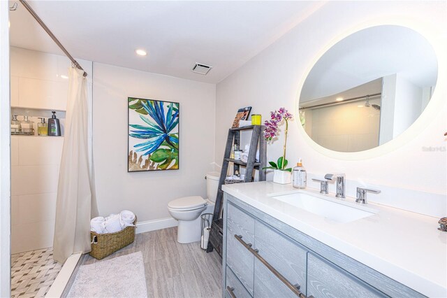 2335 Beneva Ter Unit 2254, Sarasota, FL 34232 - full bathroom with vanity, toilet, tiled shower, recessed lighting, and baseboards