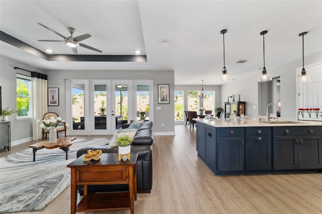 10298 SW 96th Loop, Ocala, FL 34481 - living area featuring light wood-style flooring, a ceiling fan, plenty of natural light, baseboards, and recessed lighting