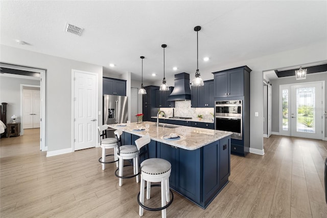 10298 SW 96th Loop, Ocala, FL 34481 - kitchen featuring custom range hood, appliances with stainless steel finishes, baseboards, a kitchen bar, and recessed lighting