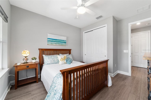 10298 SW 96th Loop, Ocala, FL 34481 - bedroom featuring a closet, wood finished floors, baseboards, and ceiling fan