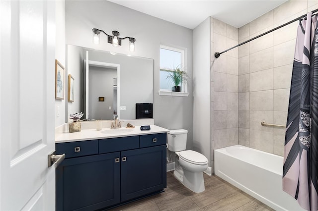 10298 SW 96th Loop, Ocala, FL 34481 - bathroom featuring vanity, toilet, shower / bath combo, and wood finished floors