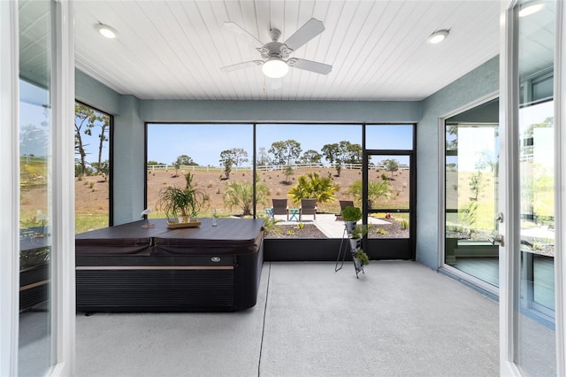10298 SW 96th Loop, Ocala, FL 34481 - sunroom / solarium featuring a hot tub, a ceiling fan, recessed lighting, and speckle patterned floor
